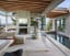 Living room with cedar ceiling and pool opening up to a deck overlooking Lake Washington, Mercer Island, WA by Garret Cord Werner