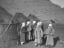 Kyrgyz women standing in front of their yurts at the foot of Quizil Tagh, circa 1907.