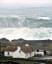 Giant waves behind a cottage at Malin Head, Donegal, Ireland.