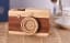 This wooden Leica is a covert music box with rotating 'lens'