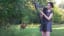 Girl attracts a deer while playing the sound of silence with a harp
