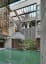 Indoor courtyard with a pond that doubles as a swimming pool in a concrete residence, Dhaka, Bangladesh