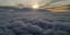 Its still sunrise above the clouds! Somewhere in the monsoon season of the Malaysian peninsular.