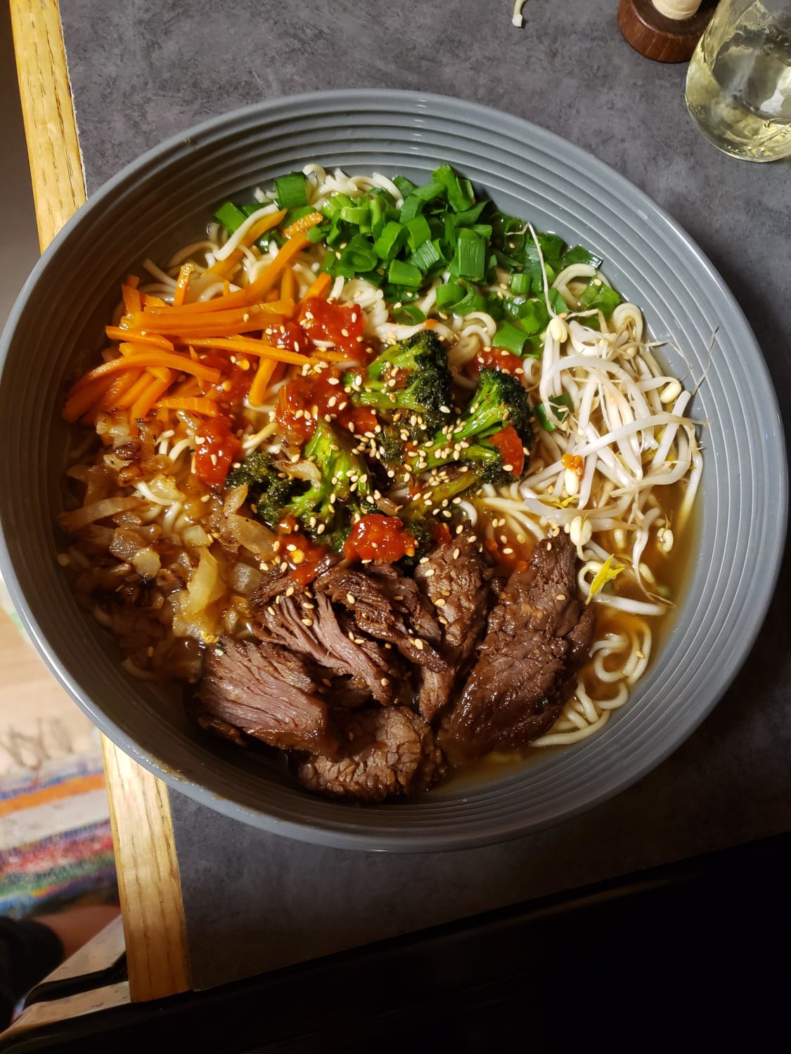 Teriyaki beef ramen with sautéed onions, broccoli, fresh bean sprouts and scallions. Drizzled with roasted chili and garlic paste.