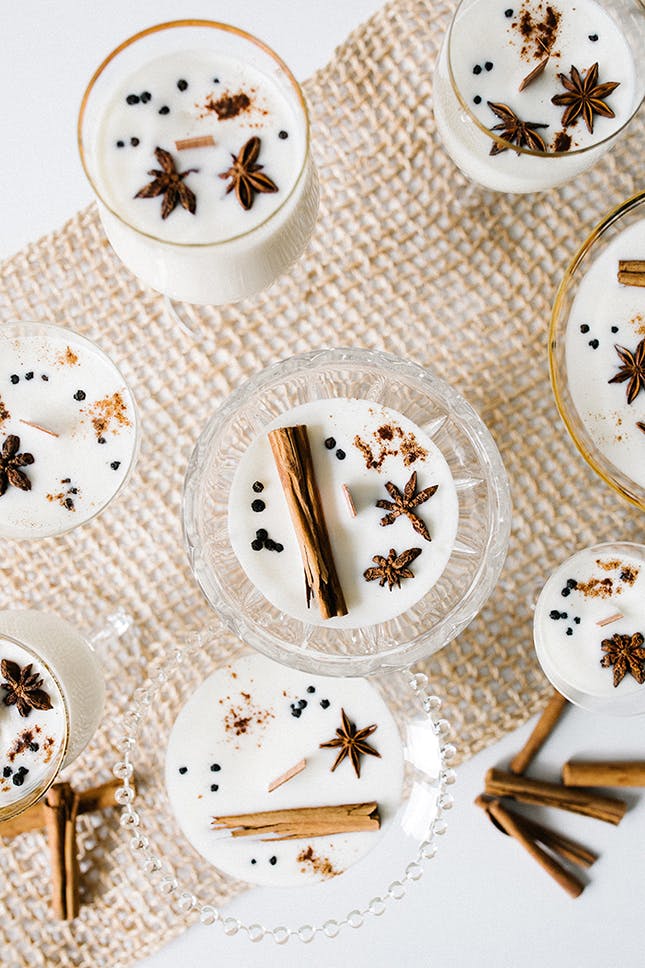 Snuggle up and get in the holiday mood! These 10 cozy essentials will keep you warm all winter long, including this DIY eggnog soy wax candle. ❄️