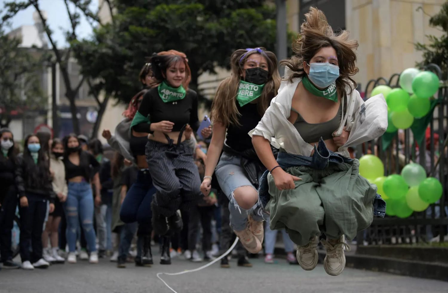 Women in Bogota, Colombia jump for joy to celebrate the decriminalisation of abortion