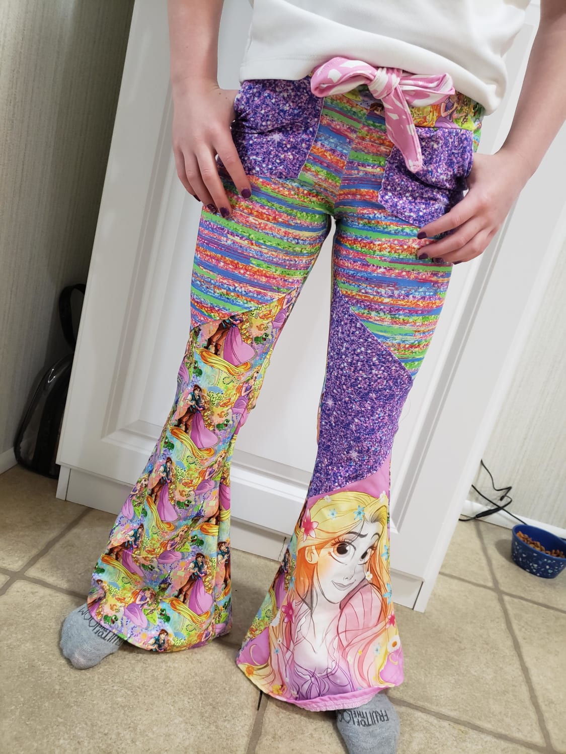 She wanted pants with glitter, purple and rapunzel! These are modified bailey bells by made for mermaids patterns sewn with cotton lycra fabric!