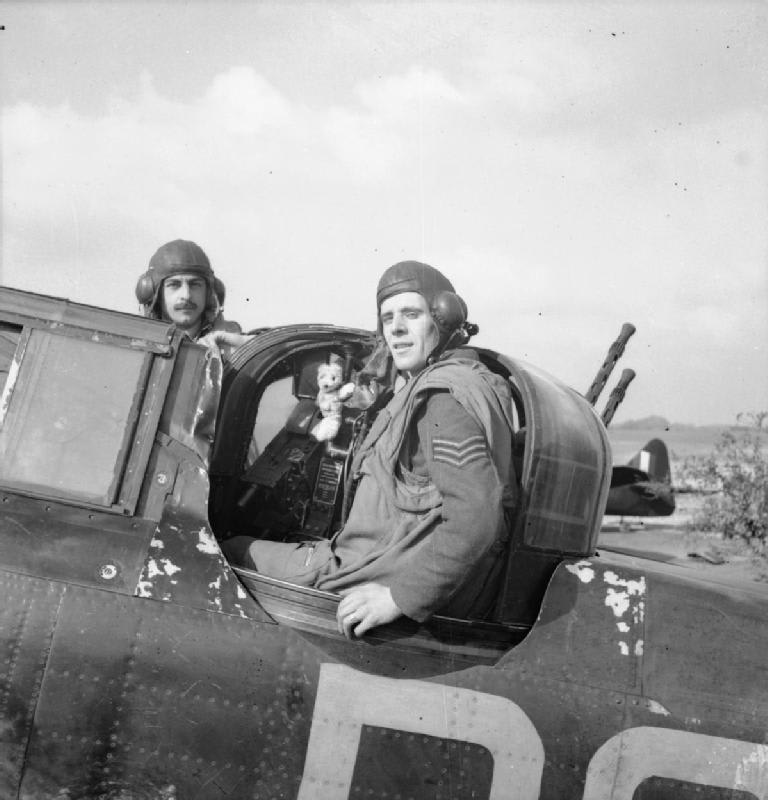 Sergeants E R Thorn (pilot, left) and F J Barker (air gunner) pose with their Defiant after claiming their 13th Axis aircraft; Thorn and Barker were the most successful Defiant crew of the war