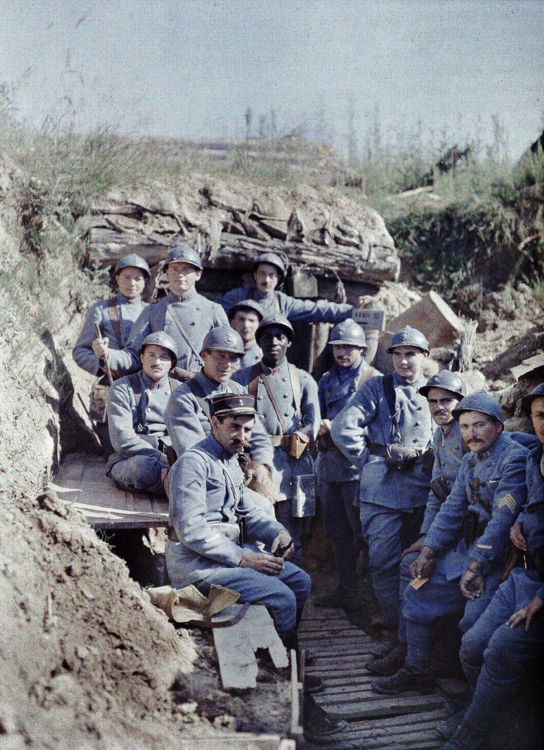 French 'poilus' ('hairy ones') soldiers posing in a trench, 16 June 1917. Note: this is an 'Autochrome' photograph, an early form of colorized photography. This is thus the original photo.