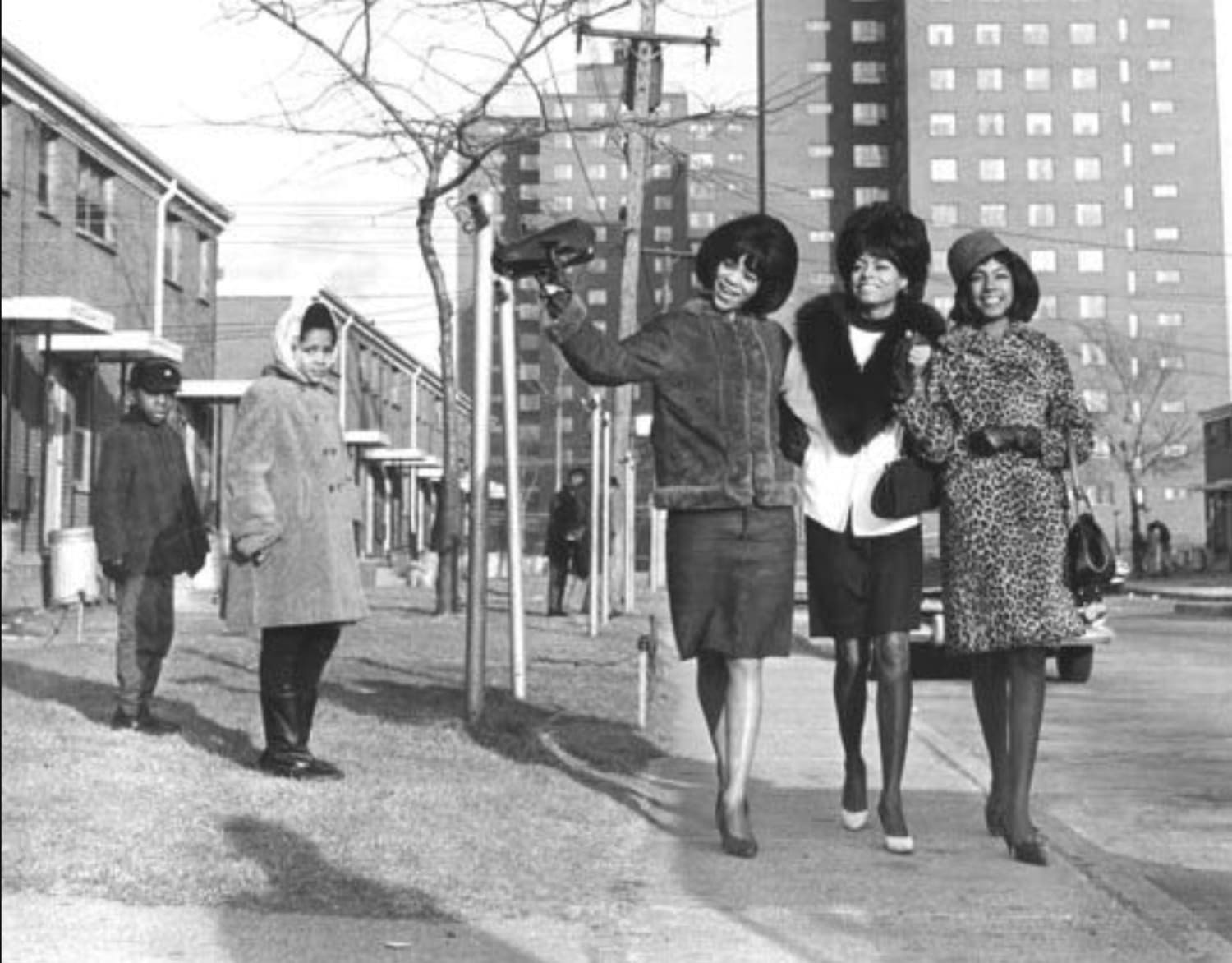 Mary Wilson, Florence Ballard and Diana Ross of The Supremes take a stroll through Detroit's Brewster Douglas Projects where they grew up. Mid 1960's [1364 - 1746]