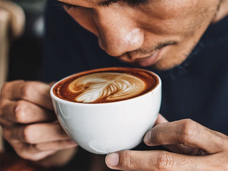 People with symptoms of cardiovascular health issues, like angina and heart palpitations, tend to drink less coffee, avoid coffee altogether, or drink decaf. These symptoms determine the amount of coffee people drink, rather than the other way round.