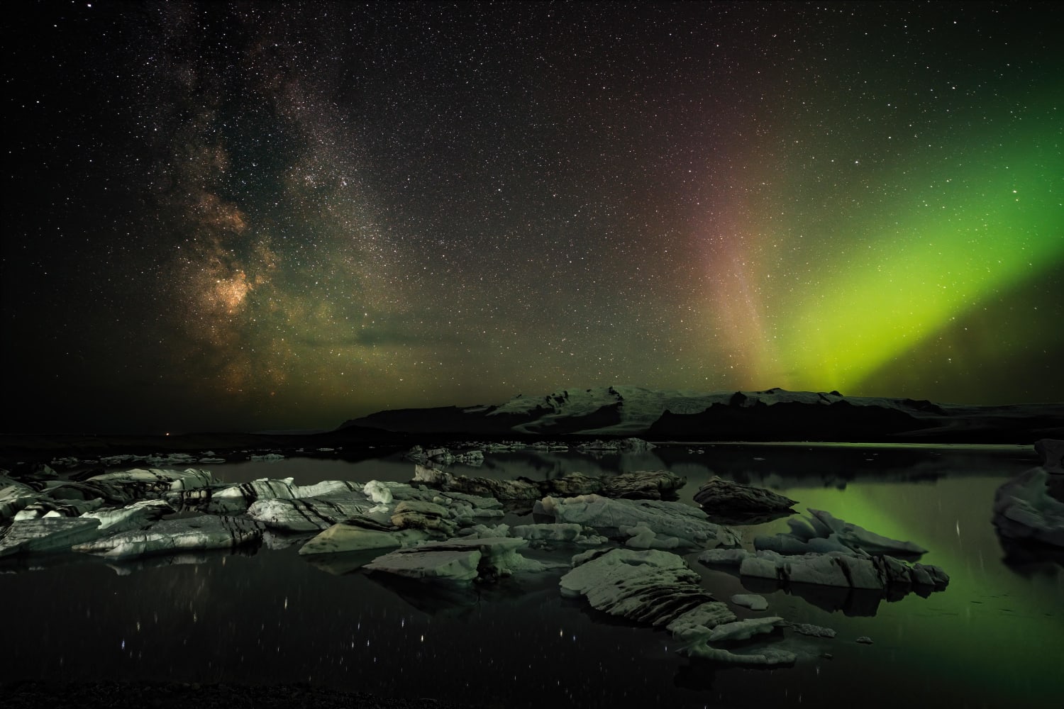 Aurora borealis and the Milky way over lake Jökulsárlón in Iceland