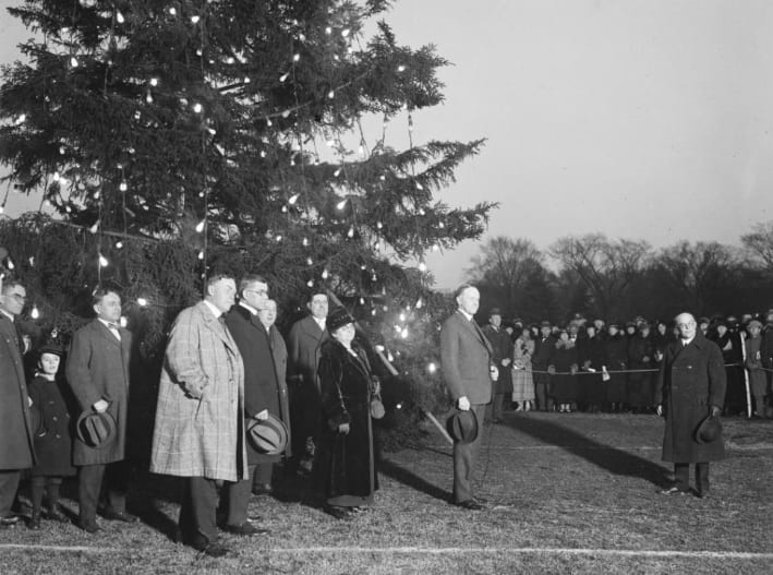 President Calvin Coolidge participates in the first national Christmas tree lighting ceremony on the White House grounds - 1923