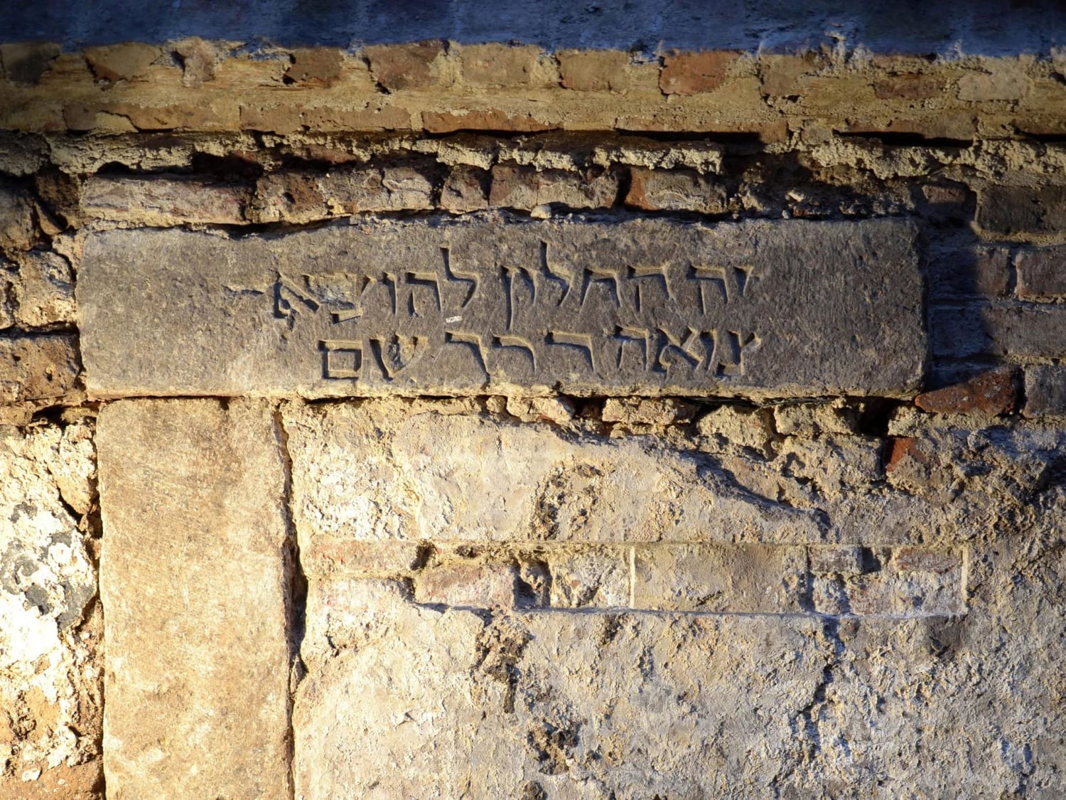 A strange Hebrew inscription from 13th century Cologne, Germany, reading "this is the window through which excrement is taken out". It apparently indicated the opening to a cesspit.