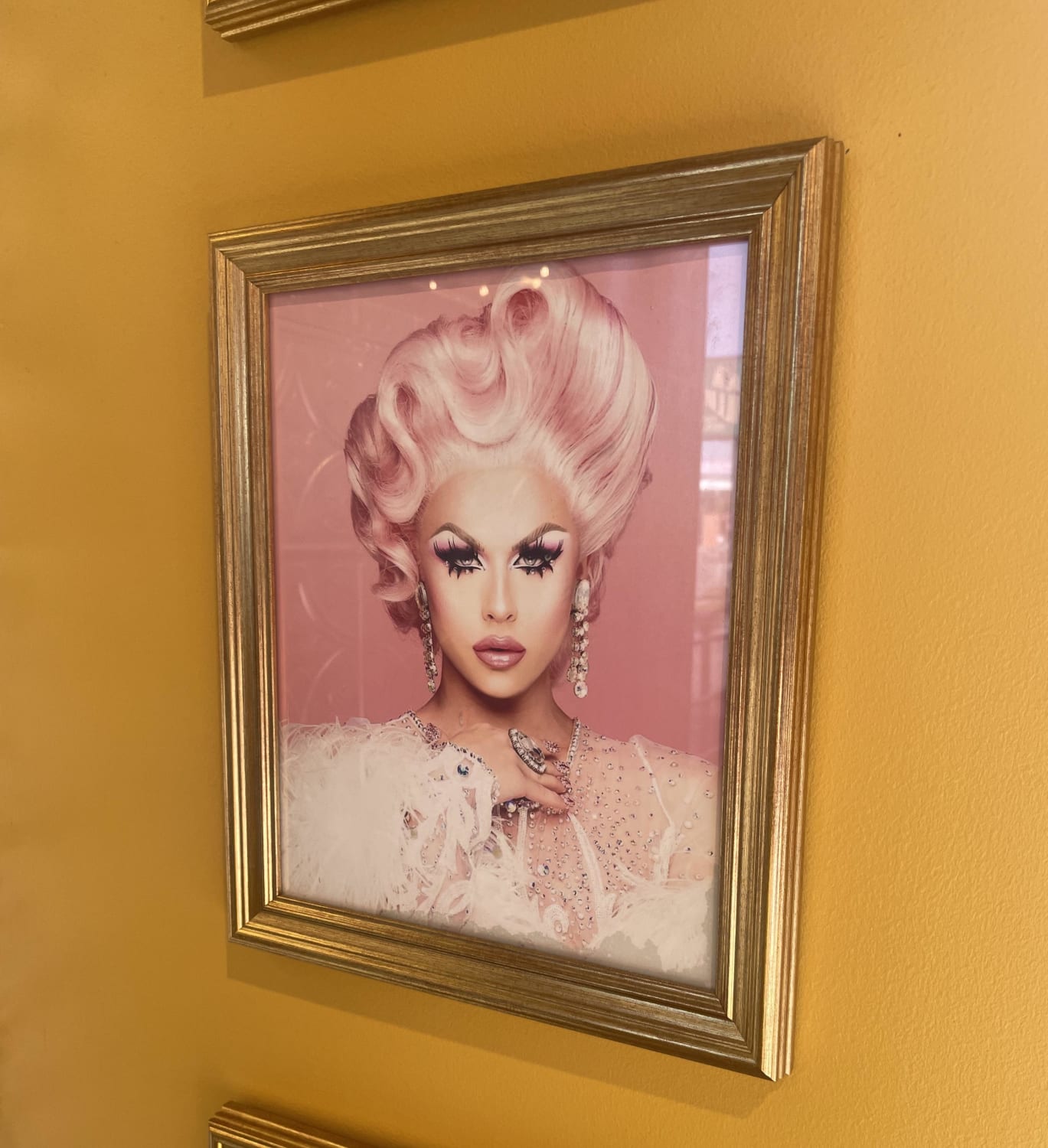 The donut store I was at has a framed picture of Farrah Moan for literally zero reason?