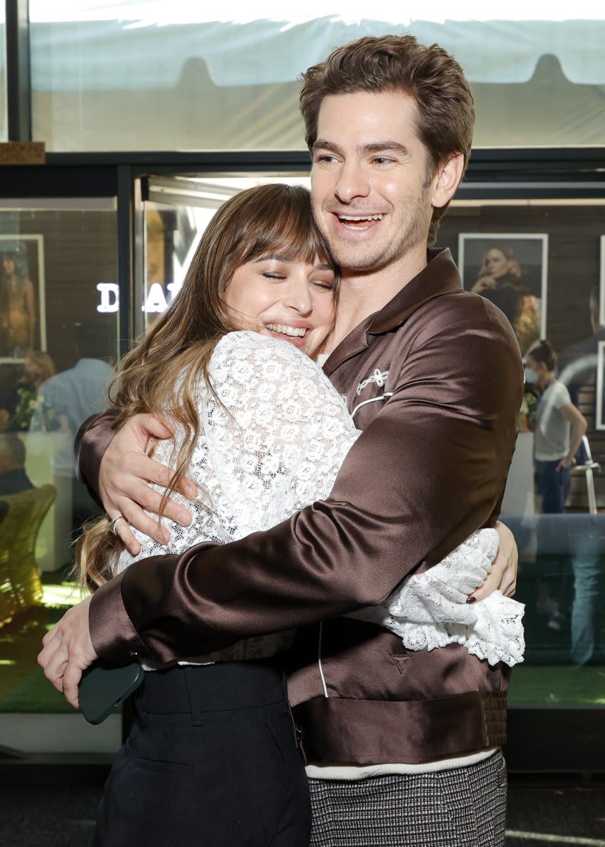 Happy first Friday of 2022. I leave you with this photo of Dakota Johnson and Andrew Garfield in a warm embrace — you're welcome. 🥺