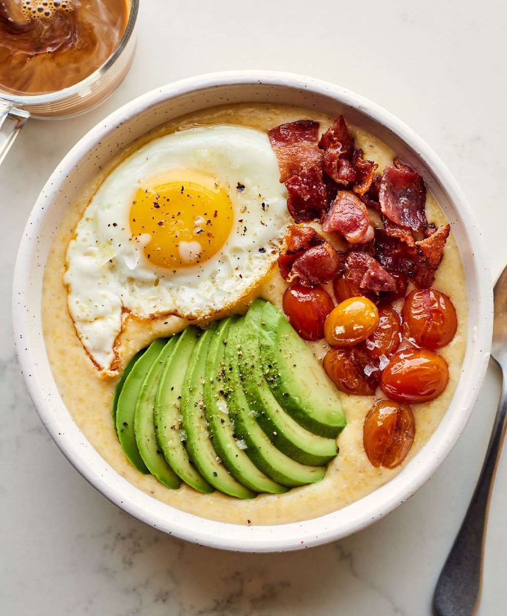 Cheesy grits with fried eggs and bacon is everything you want for breakfast: