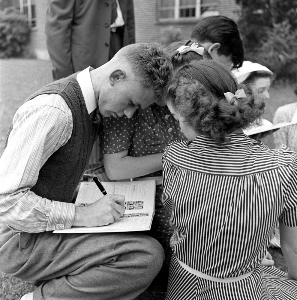 Signing yearbooks before graduation. Mansfield, Ohio, Senior High School, 1941.