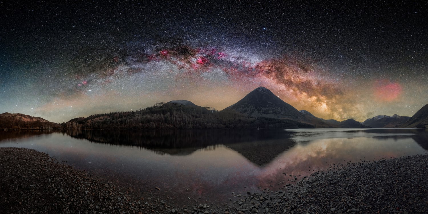 I used my astro-modified DSLR and star tracker to create this super detailed high resolution panorama image of the milkyway arch over Crummock Water in The Lake District, UK.