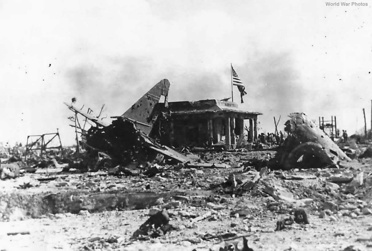 American flag over ruins of Japanese Headquarters on Namur Island, Kwajalein.