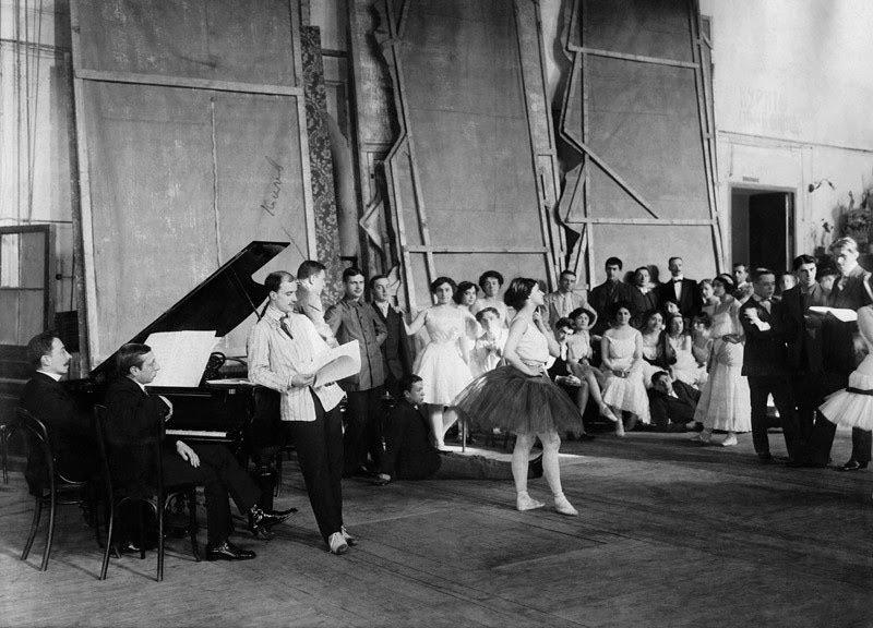 Rehearsal for the premiere of Stravinsky’s The Firebird. He is sitting at the piano, watching Mikhail Fokine give notes to Tamara Karsavina. 1909.