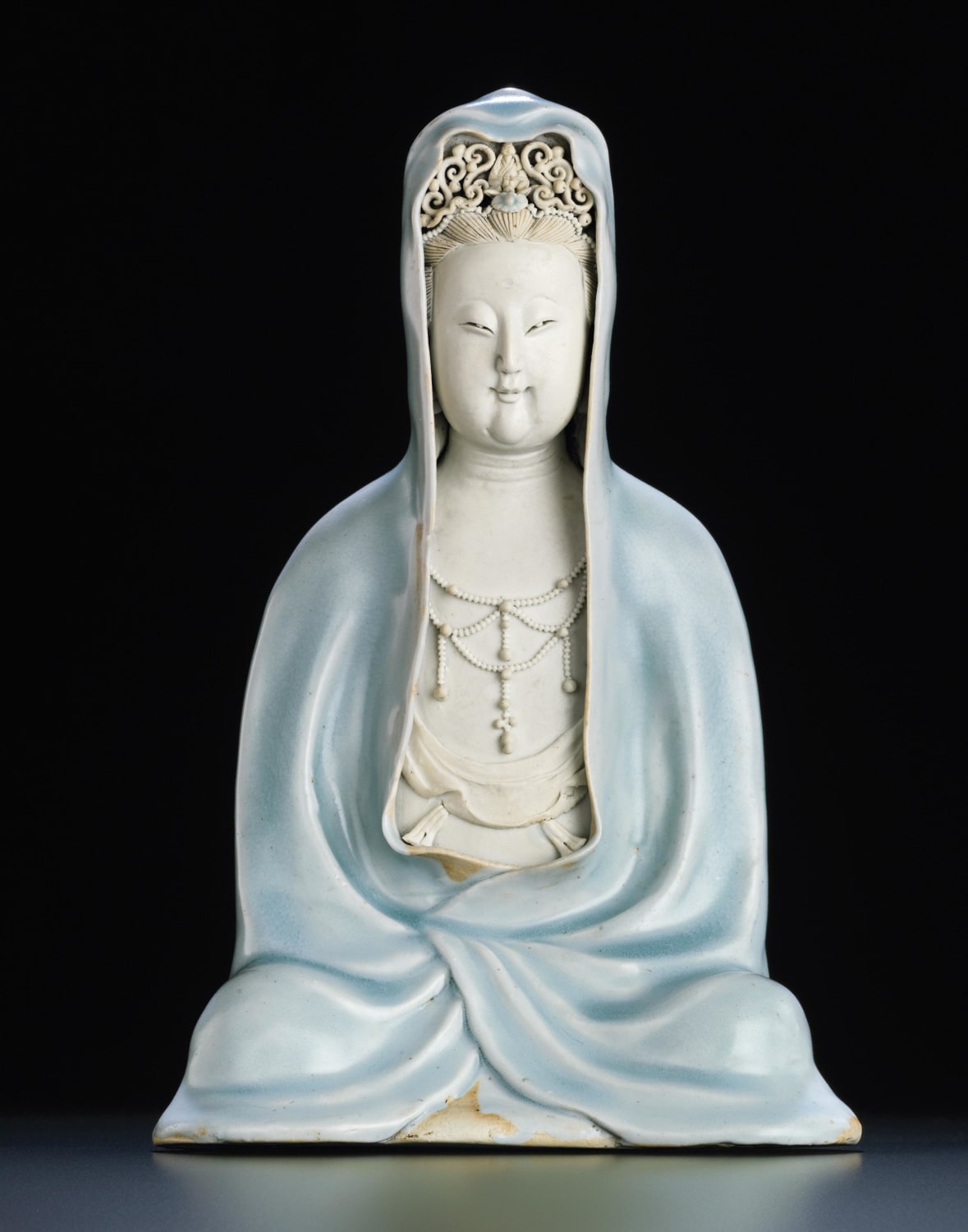 A Qingbai seated figure of Guanyin, southern Song dynasty (1127-1279). Sold at Christie's in 2011 for a world record auction price for Qingbai porcelain