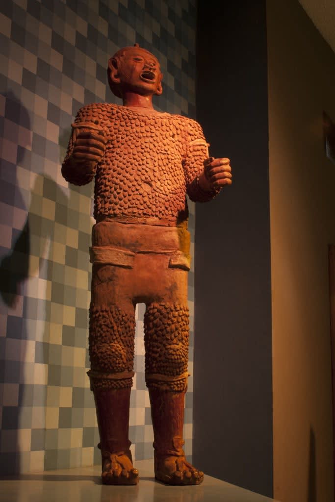 Life-size terra cotta figure of the deity Xipe Totec ("the Flayed Lord"), Nahuatl or Toltec, from near Texcoco, Mexico, 9th or 10th century AD [OS]