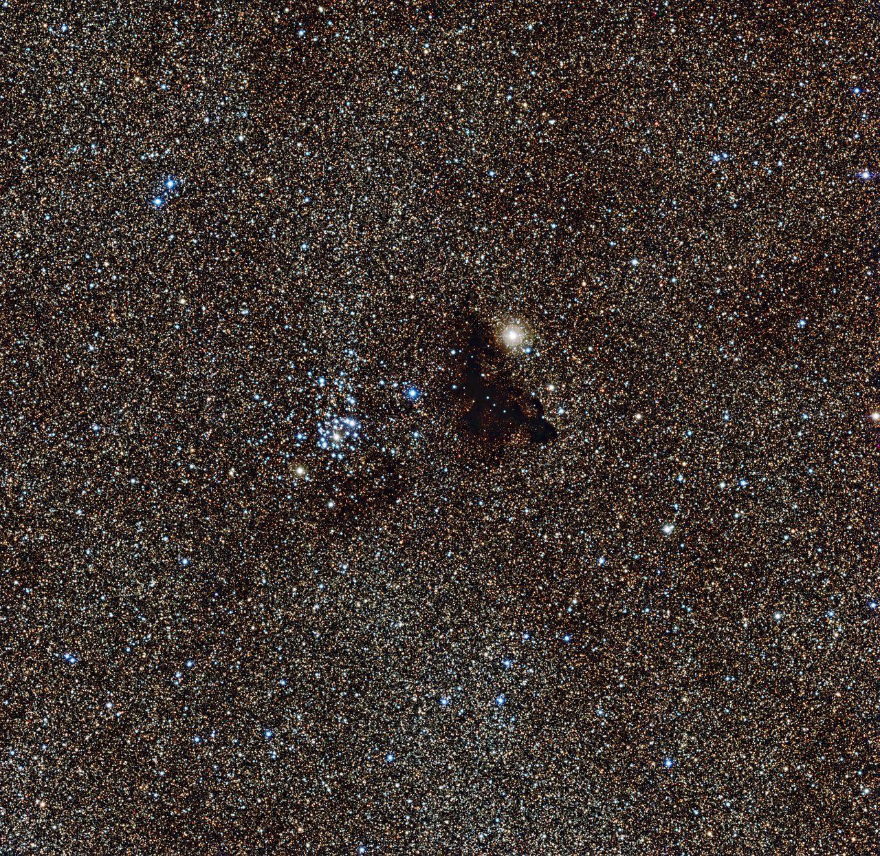 Star cluster NGC 6520 and Barnard 86, a strangely dark gas cloud. Zoom in and you’re actually able to see countless individual stars. Keep in mind, each star is still light years apart from each other.