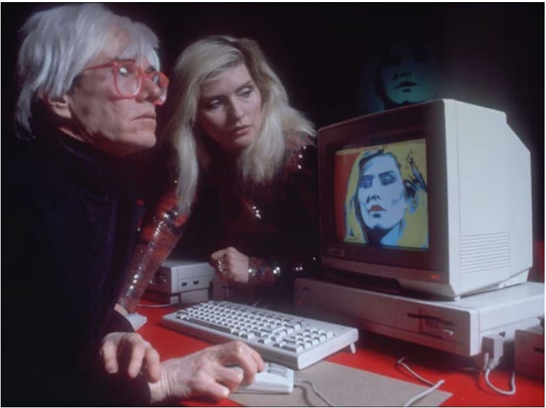Andy Warhol drawing a picture of Debbie Harry on a Commodore Amiga, 1985
