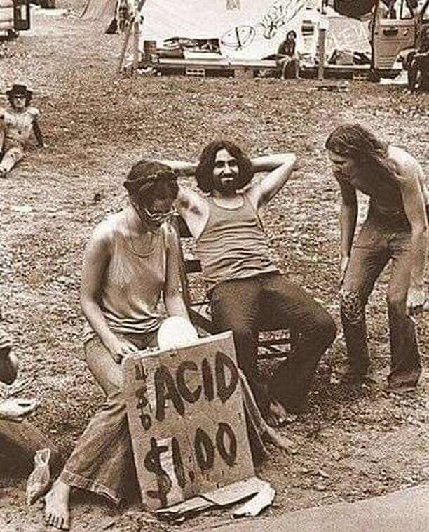 Hippies at the original 1969 Woodstock festival sell LSD for just one dollar.