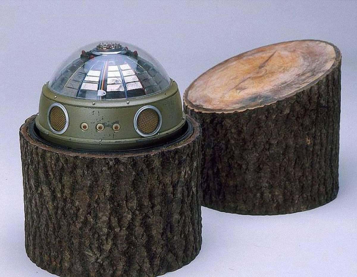 KGB spy gadget: a device for picking up radar and air defense system signals disguised as a tree stump, with the capacity to relay information by satellite.