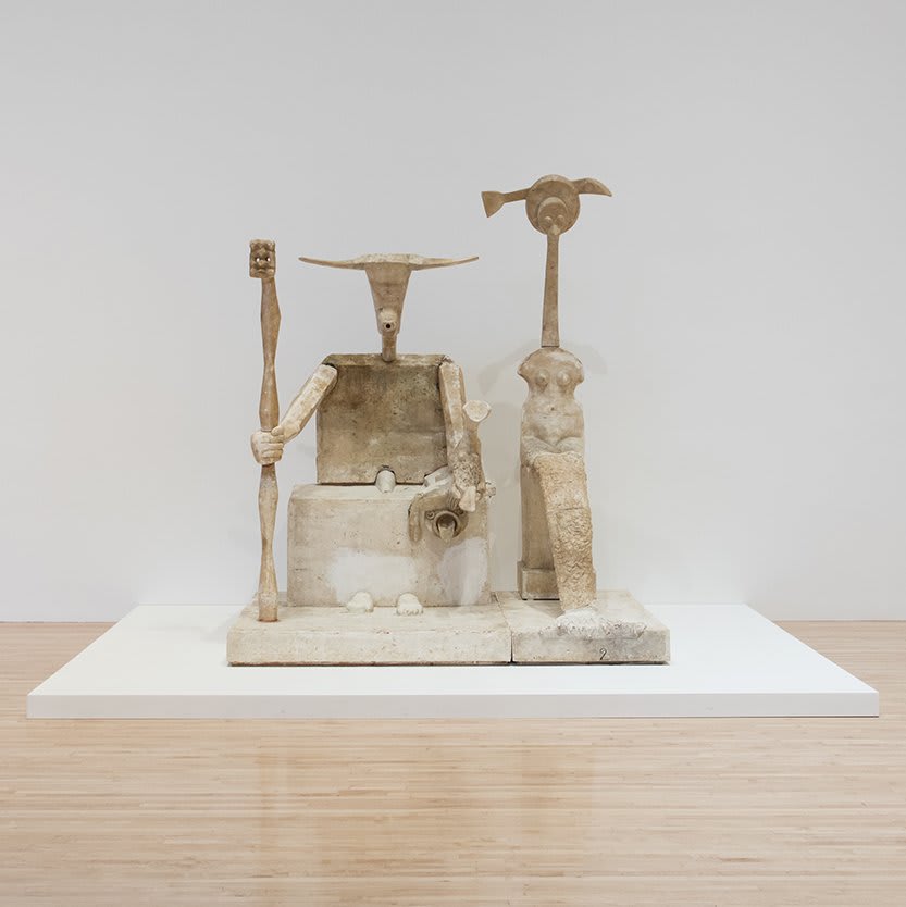 Max Ernst’s sculpture Capricorn (1948-1963) depicts two enthroned figures. The work references the 10th astrological sign of the zodiac, commonly represented by a creature with the upper body of a goat and lower body of a fish.