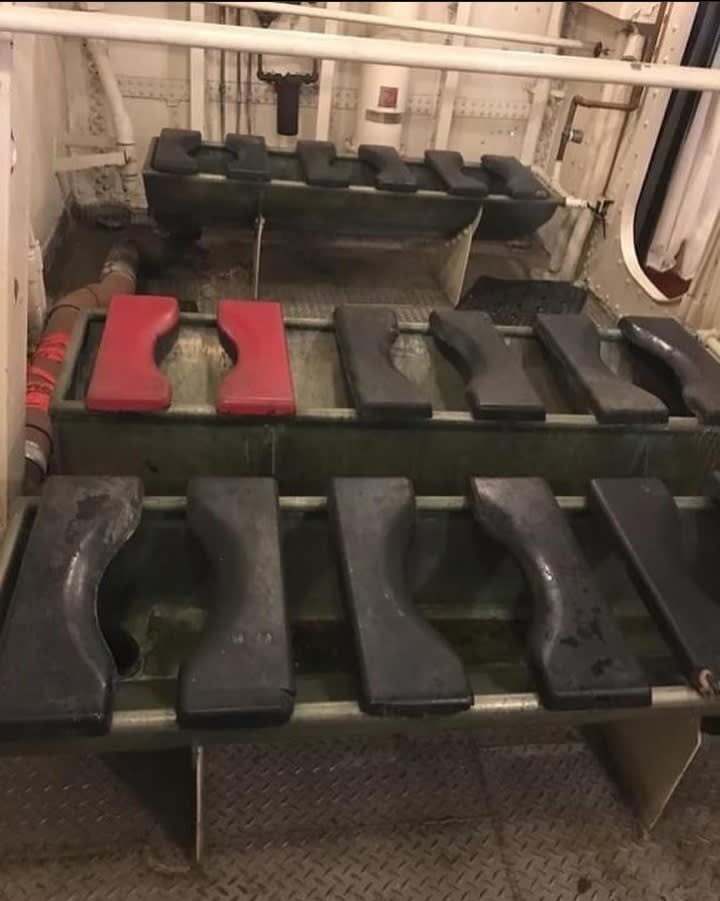 Head (ship's restroom) of Navy Destroyer USS Kidd that sailed from 1943 to 1967. One seat is painted red: This was called the "Hot seat" and it was reserved for crew who had sexually transmitted diseases.