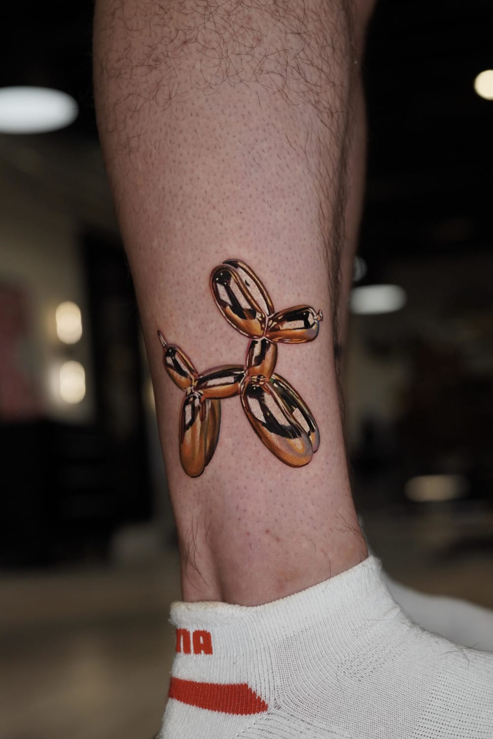 Golden Balloon Dog made by me, Pony Lawson at my shop Mayday! Tattoo Co in Chicago.