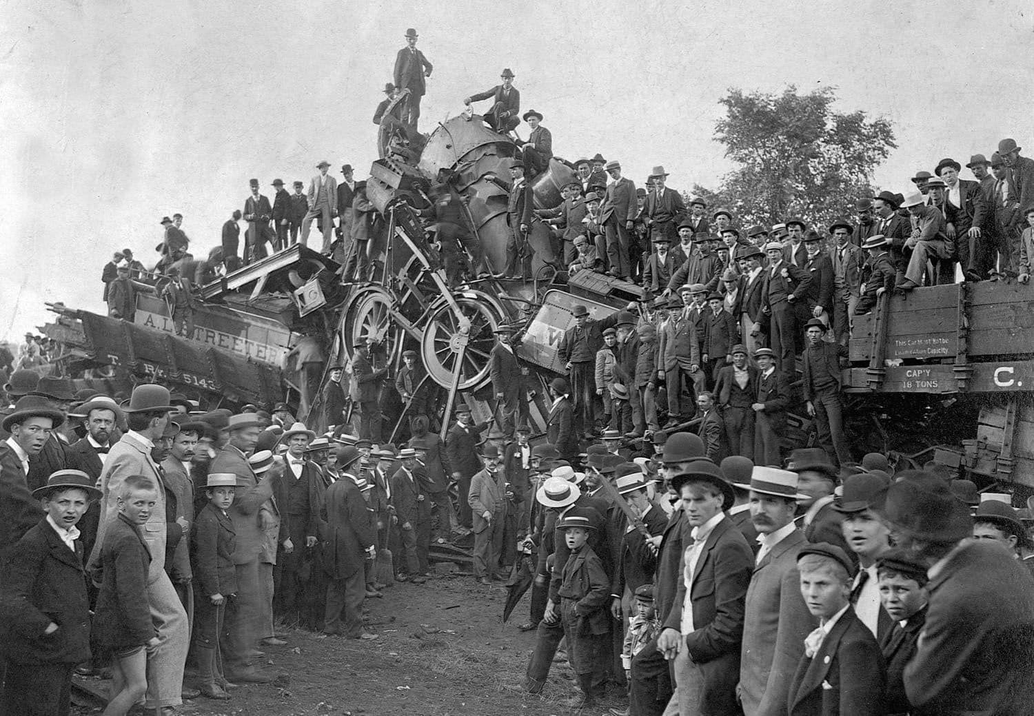 Men and boys pose with the wreckage of a train in Buckeye Park. Lancaster, Ohio, 1896.