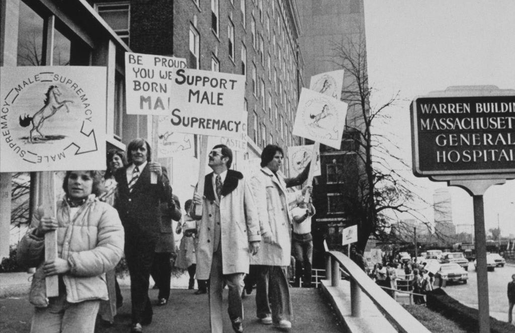 Protestors from the Male Supremacy movement picketing the sperm bank in the Warren Building of Massachusetts General Hospital in Boston, 1975.