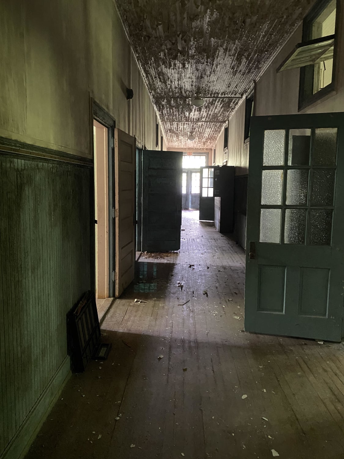 A hallway in one of three buildings that make up the abandoned Pleasant Hill Middle School in Hemingway, SC. An African American school built in 1938, integrated in the ‘50s, abandoned in the year 2000 and added to the national register of historic places in 1998.