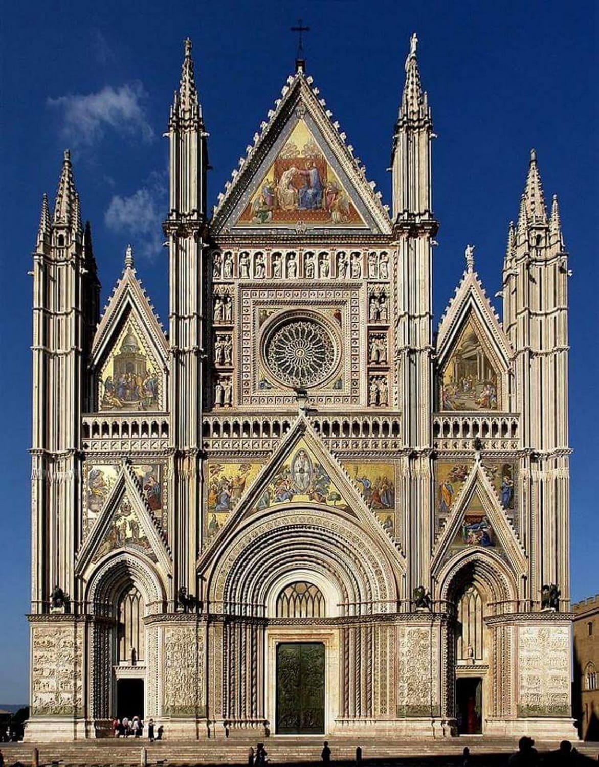 The Duomo of Orvieto - Orvieto, Italy - Construction begun 1270 by architects Arnolfo di Cambio and Lorenzo Maitani in Italian Gothic and Romanesque architecture with Lorenzo Maitani being credited for the magnificent facade - Completed 1591