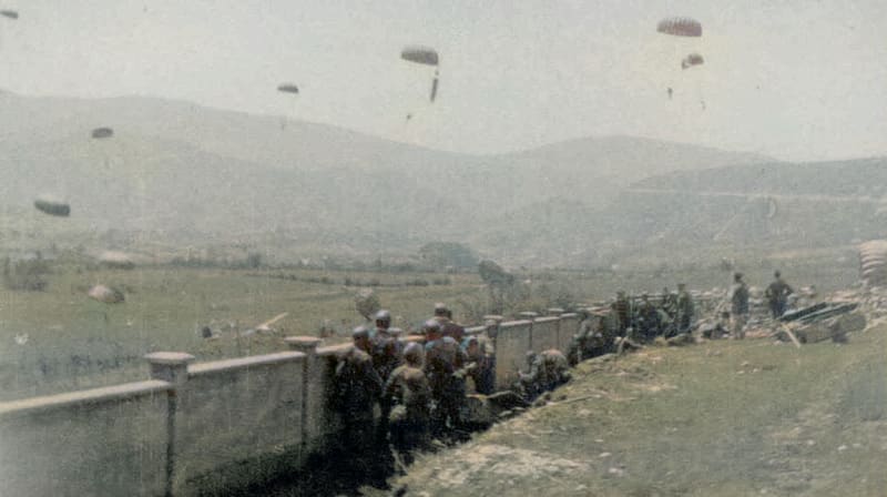 [Corrected] SS-Fallschirmjäger paratroopers under Otto Skorzeny's command land near Drvar, Yugoslavia, with the goal of capturing or killing the partisan commander Tito. The partisans managed to evacuate Tito in time. Operation Rösselsprung, May-June 1944. Colorized