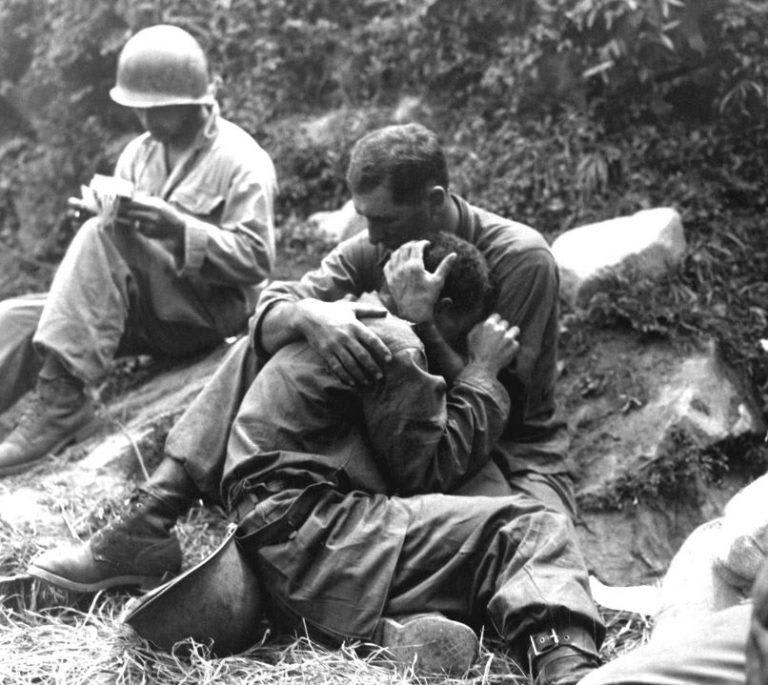 A soldier comforting another soldier during the Korean War. Not sure if this photo was taken during the Battle of the Pusan Perimeter (Summer 1950) or later. Can anyone provide any additional information as this is one of the most iconic photos of the war.