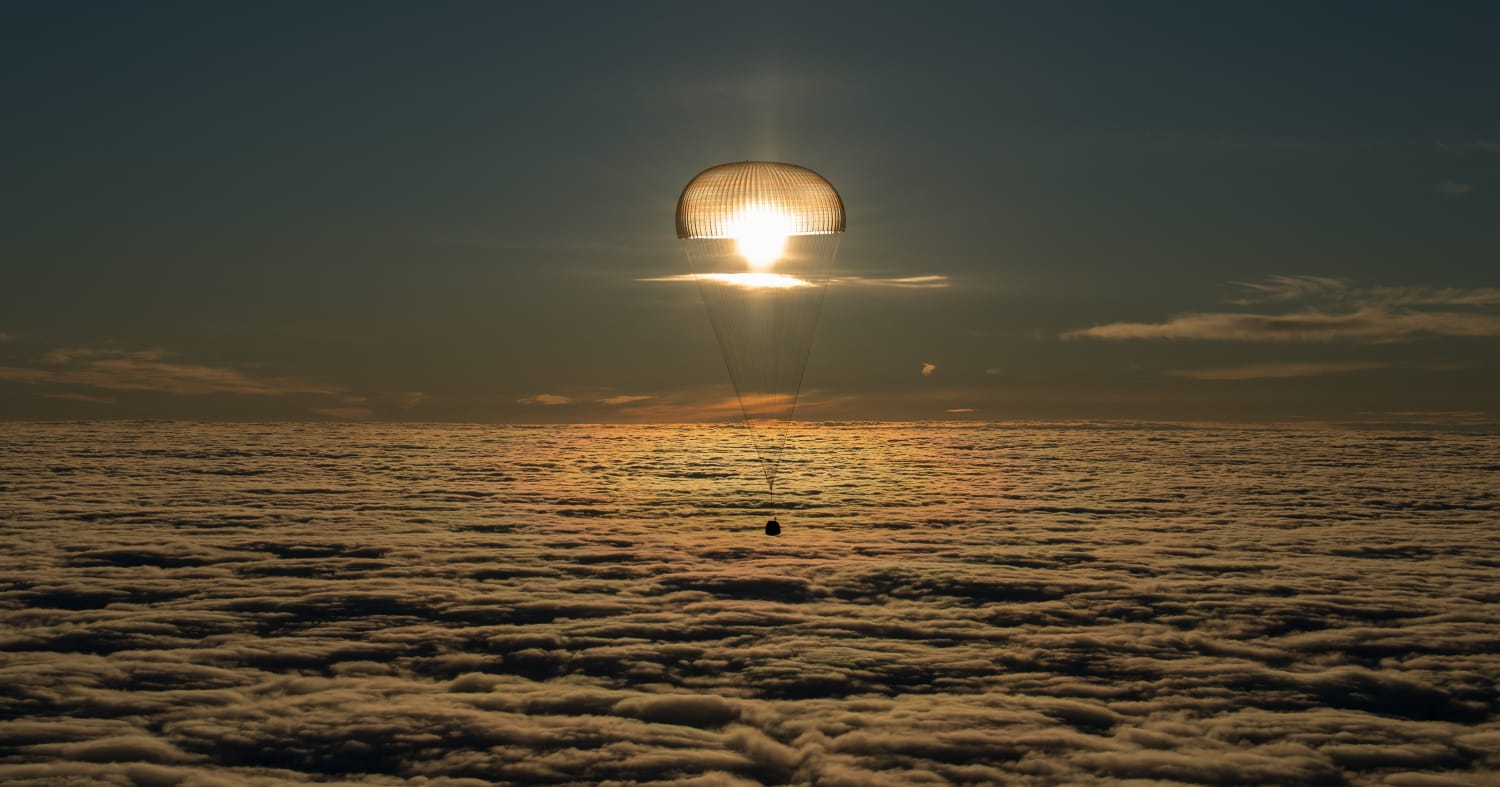 PsBattle: Sun, clouds, and a spacecraft with its parachute