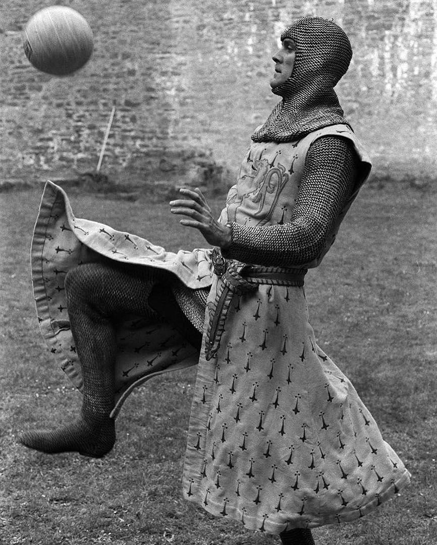 John Cleese playing Football in between takes of "Monty Python and the Holy Grail". 1974 ,080]