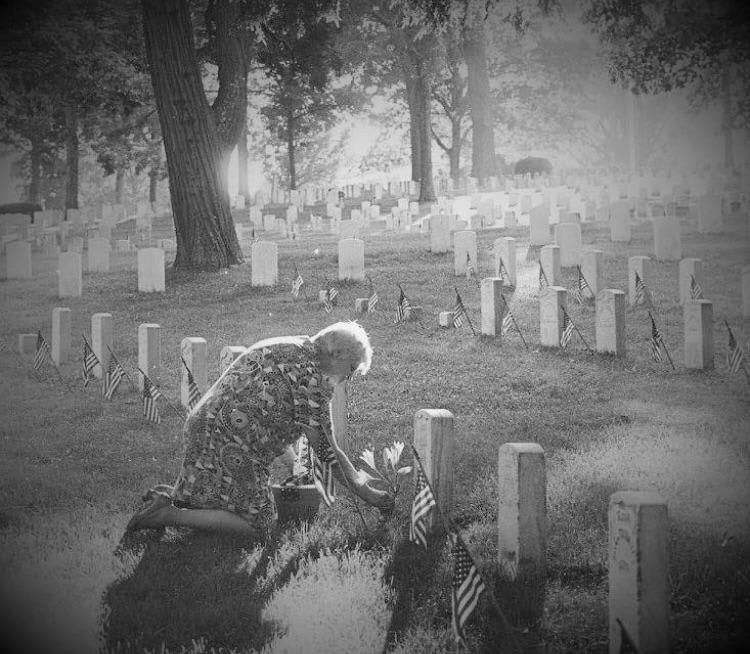 On Memorial Day 1976, amid silent white tombstones and miniature flags honoring the nation’s war dead, Pauline Manning knelt in silent prayer at the grave of her brother Vernon who was killed in WWII.