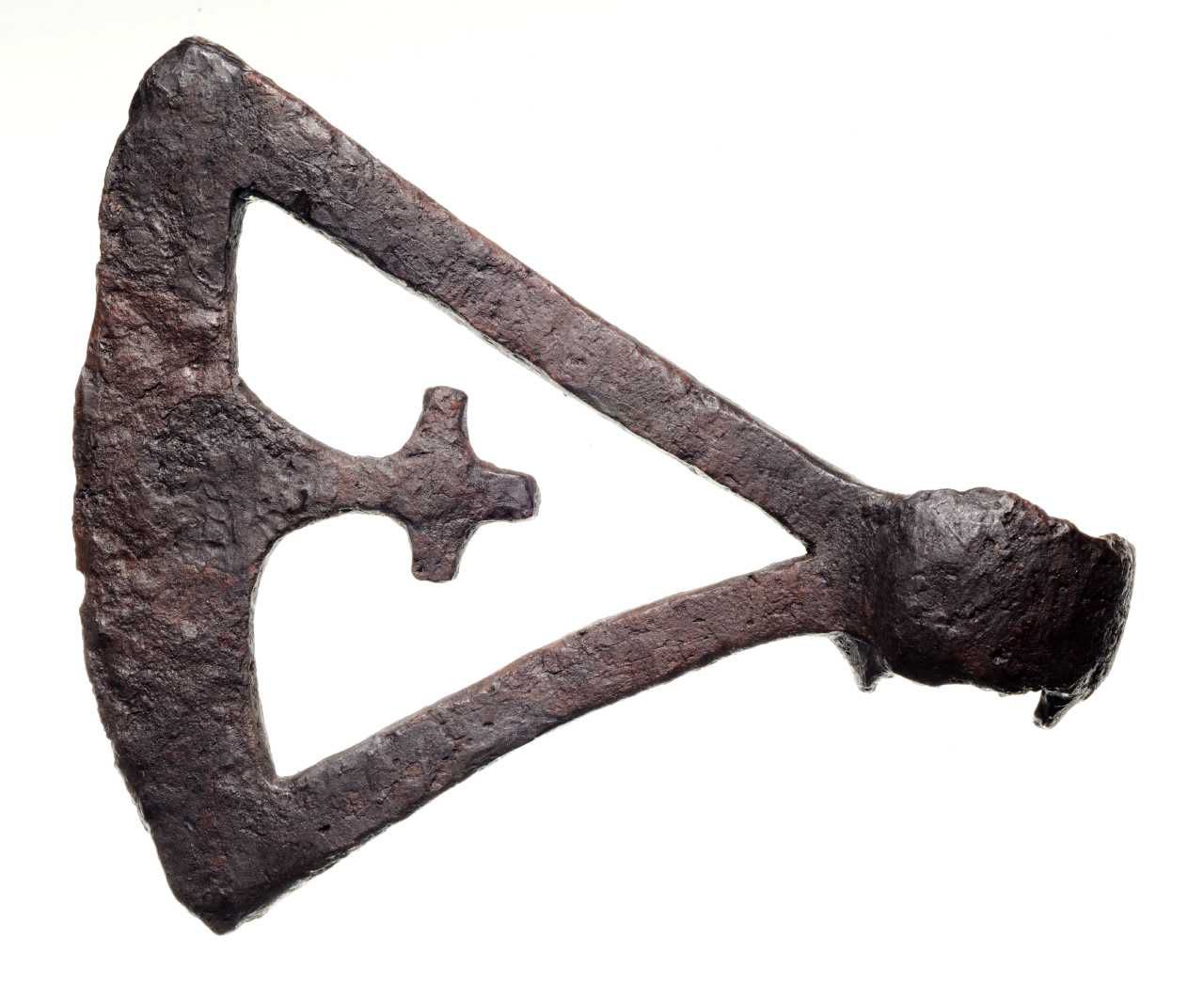 One of the six known Viking Age perforated axe head with a cut-out cross design, dating from 950 - 1050. This specific model is from Ludvigshave, Denmark.