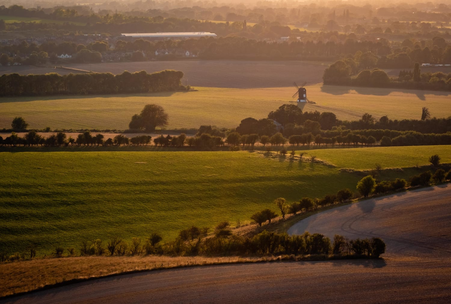 The view from Ivinghoe Beacon looking towards Pitstone Windmill at Sunset. UK