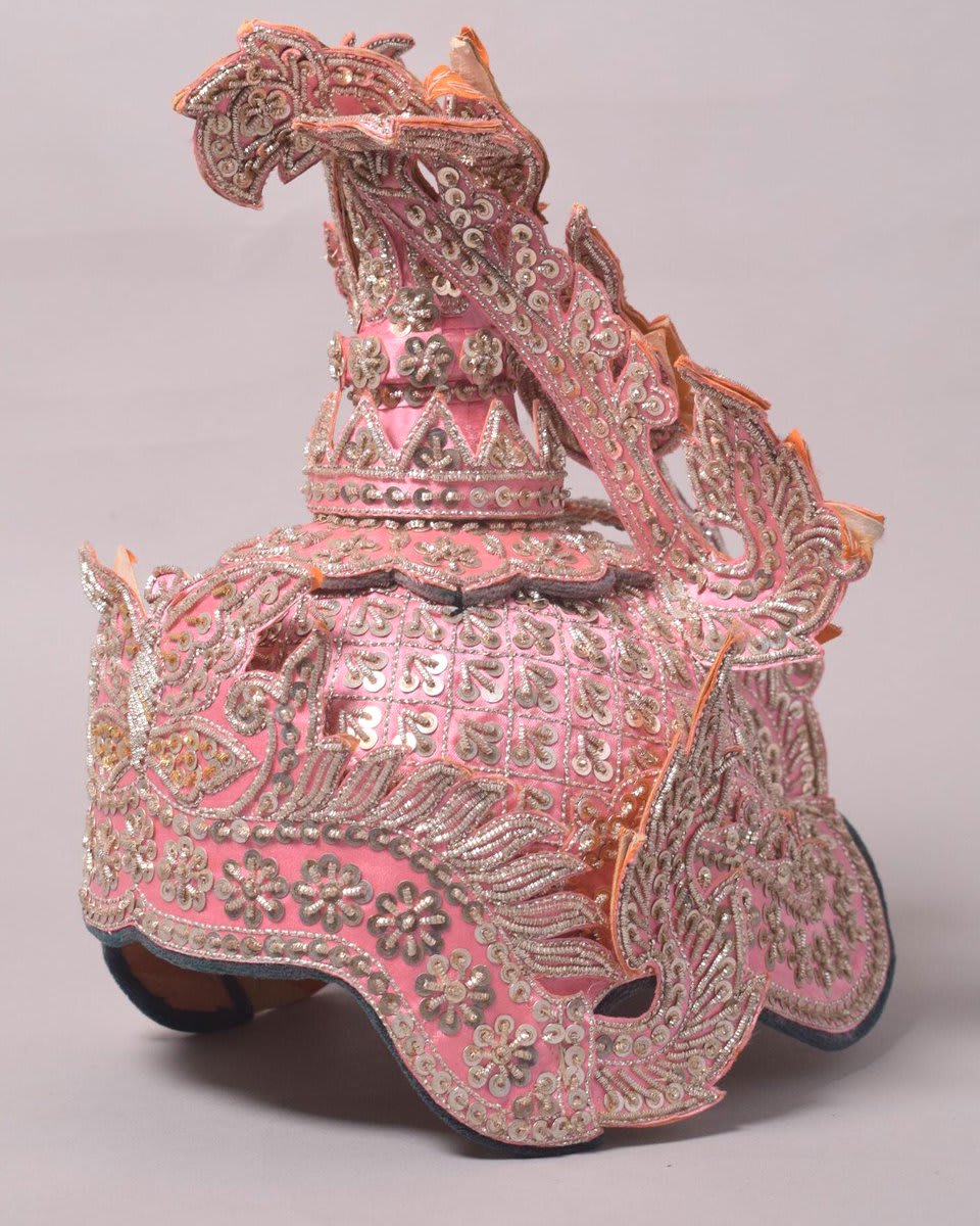 A 19th century crown for a pink princess. Winged crowns like these were worn by princesses in the 19th century court of the Burmese Konbaung Dynasty. This is a copy made in the 1930s.
