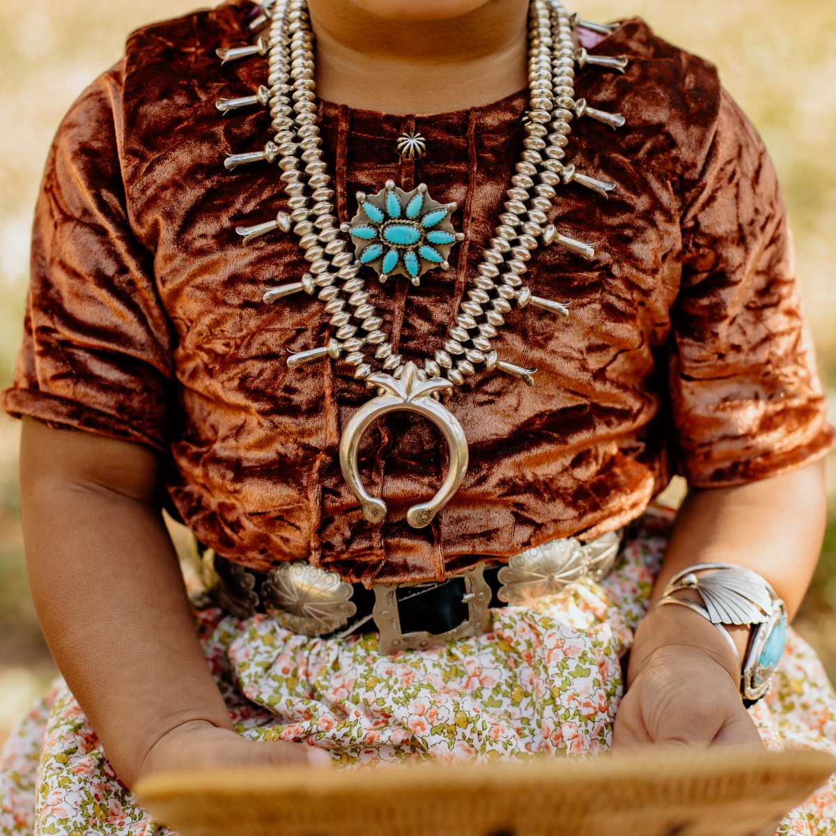 "The wedding basket symbolizes the path of life from infancy (center) to elderly (outer sides) years of one's life. Her jewelry lay and is worn as armor of strength and protection." 📸 + 💭: Char Yazzie (IG // charyazziephotos)