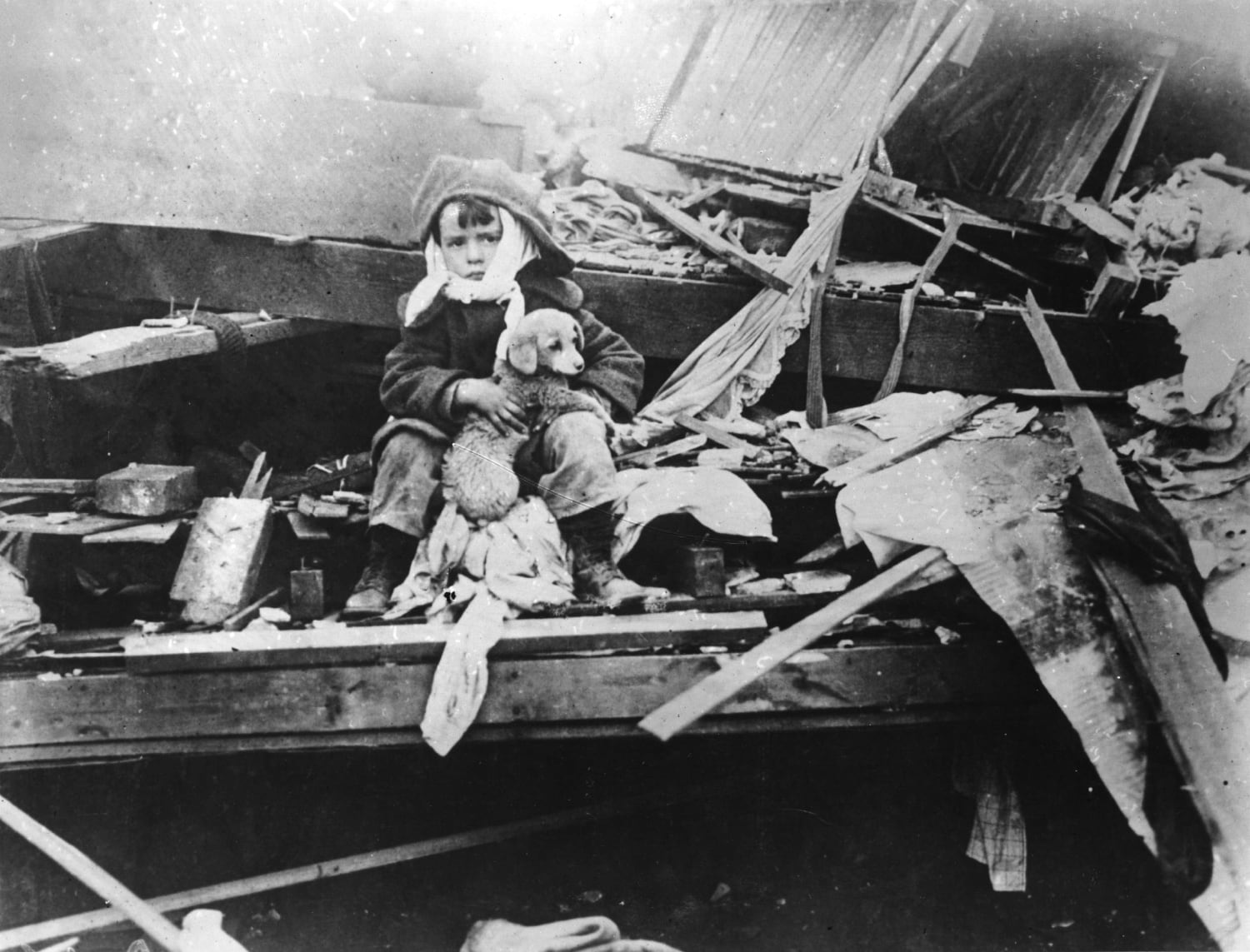 Boy and his puppy amid the wreckage of Murphysboro, Illinois after the passage of the infamous Tri State tornado. It was the single deadliest tornado of all time, killing 695 people and leaving 15,000 homeless. March 1925