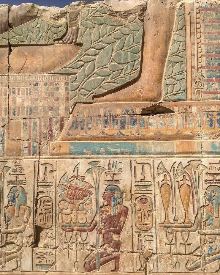 A painted relief at the temple of Ramesses II (1279–1212 BC) in Abydos, Egypt, showing the remains of what would have been a scene of the Ished tree