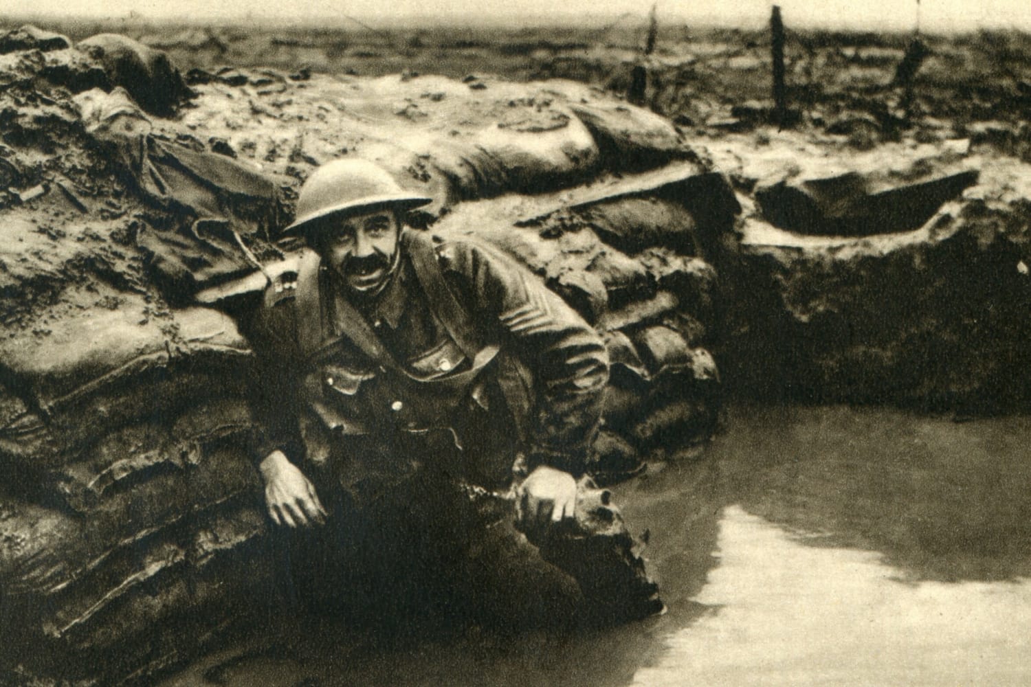 A British soldier rests in a waterlogged trench in Belgium, during the battle of Pashendale, September of 1917